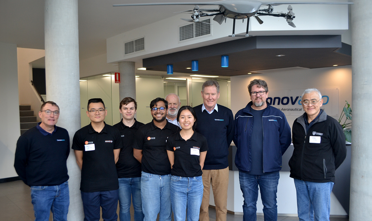 Group shot of Sydney UAV Engineering (SUAVE) team with Innovaero team members at Innovaero facilities in Perth